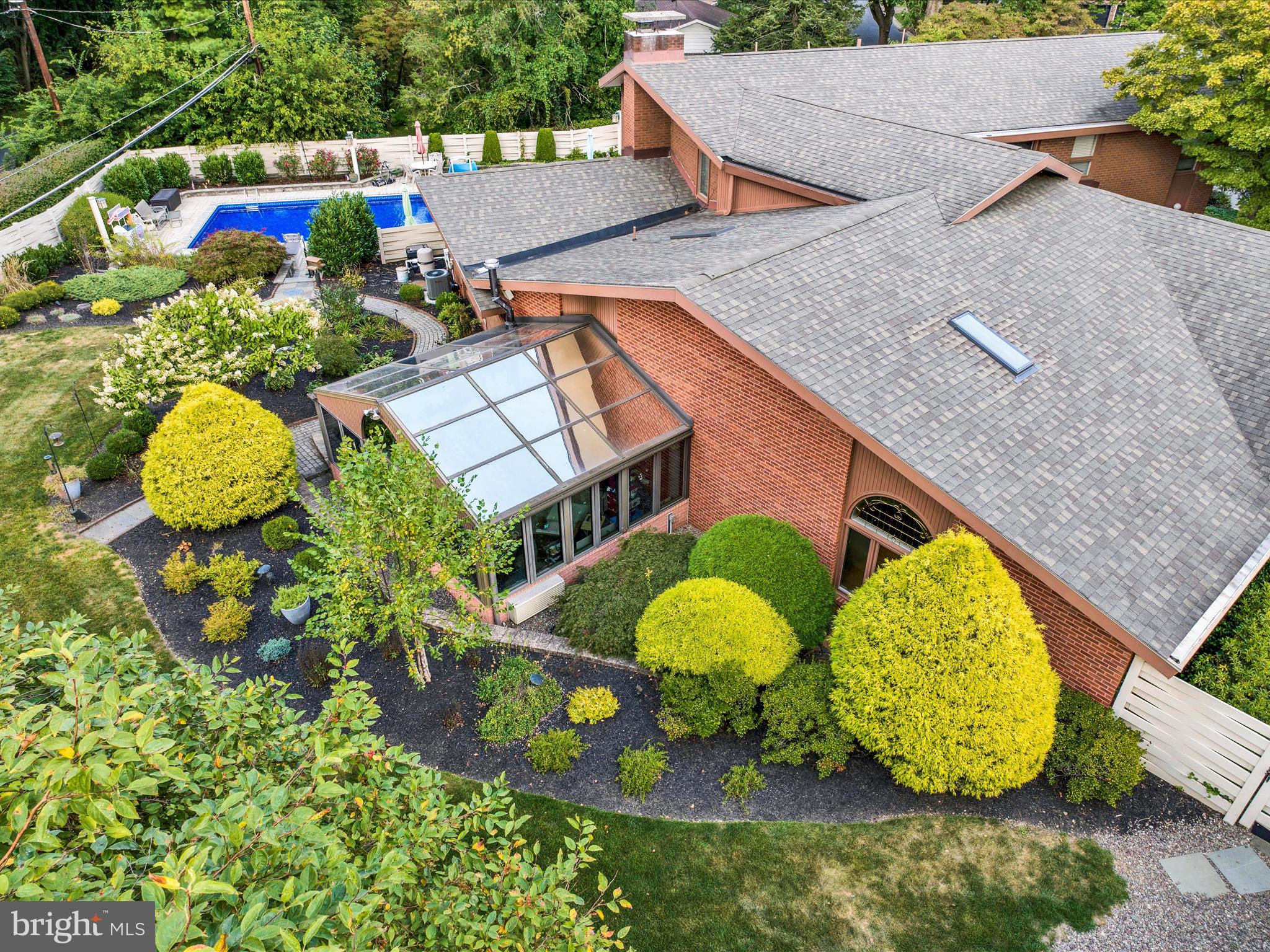 1617 Meadowlark Road Wyomissing, PA 19610 - Photo 95 of 99 an aerial view of a house with a swimming pool and outdoor seating