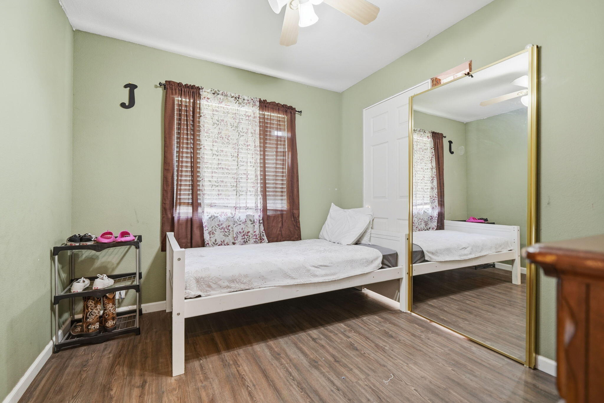 3661 Rabbit Lane Cottonwood, CA 96022 - Photo 16 of 38 a bedroom with a bed and wooden floor