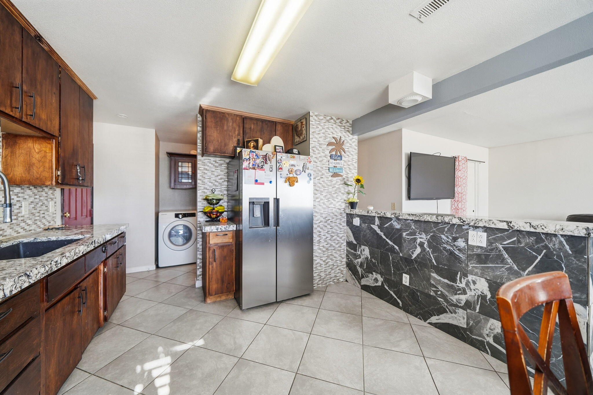 3661 Rabbit Lane Cottonwood, CA 96022 - Photo 9 of 38 a kitchen with stainless steel appliances granite countertop a stove a sink and a refrigerator