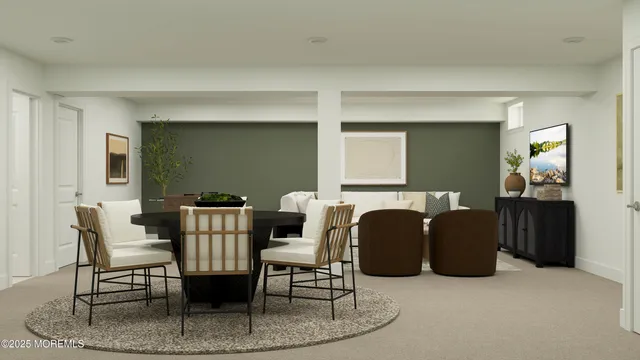 a dining room with furniture and a mirror