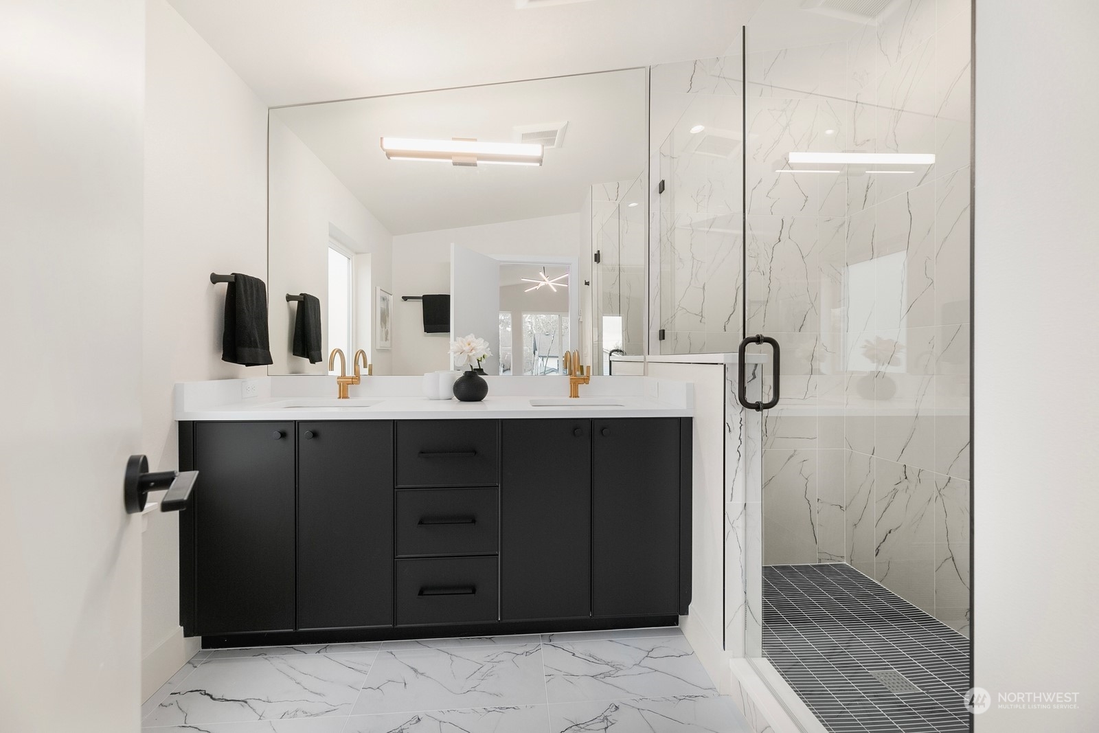 337 Northeast 90th Street, Unit 3 Seattle, WA 98115 - Photo 16 of 20 a bathroom with a double vanity sink a mirror and shower