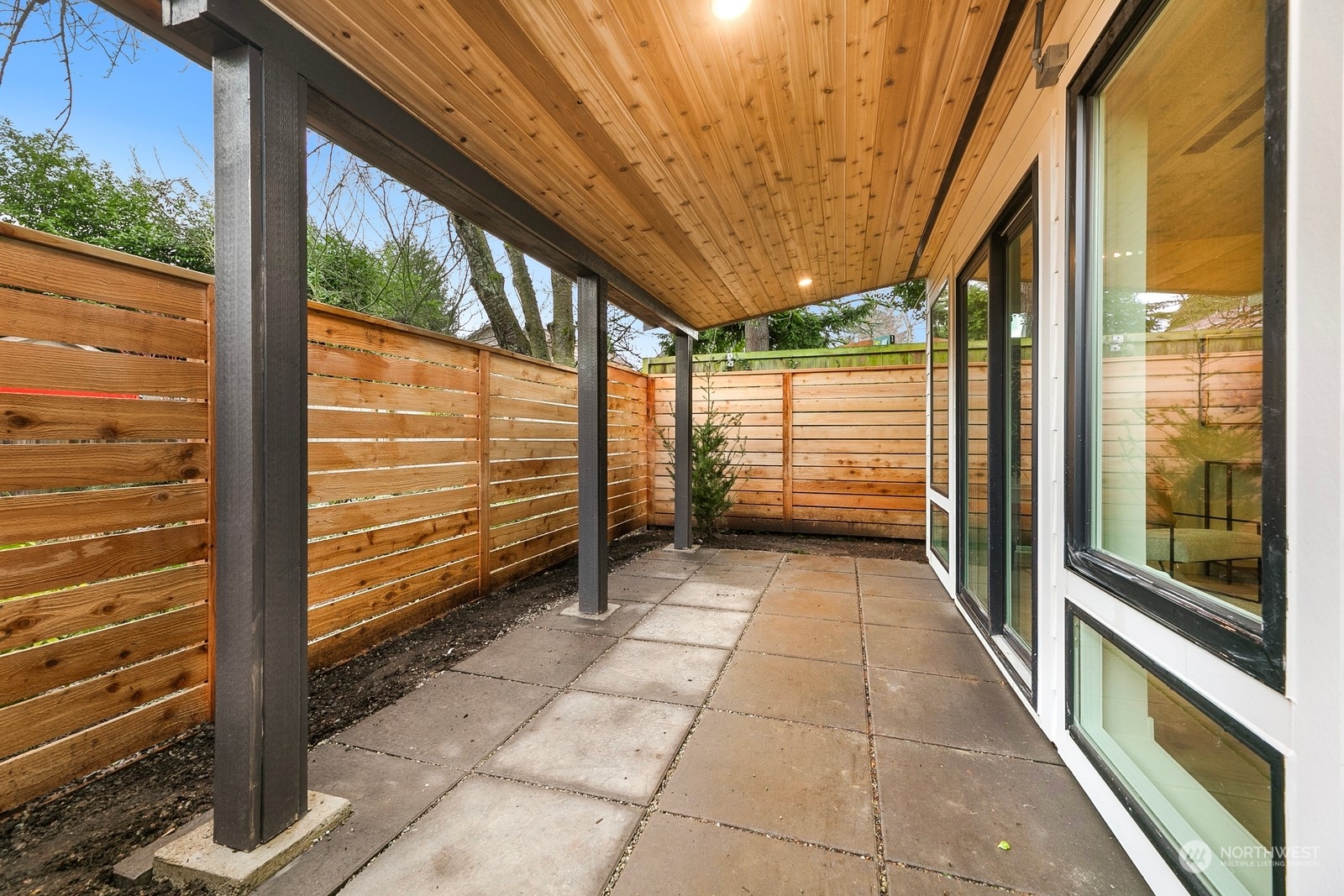 337 Northeast 90th Street, Unit 3 Seattle, WA 98115 - Photo 17 of 20 a view of a back yard from a room