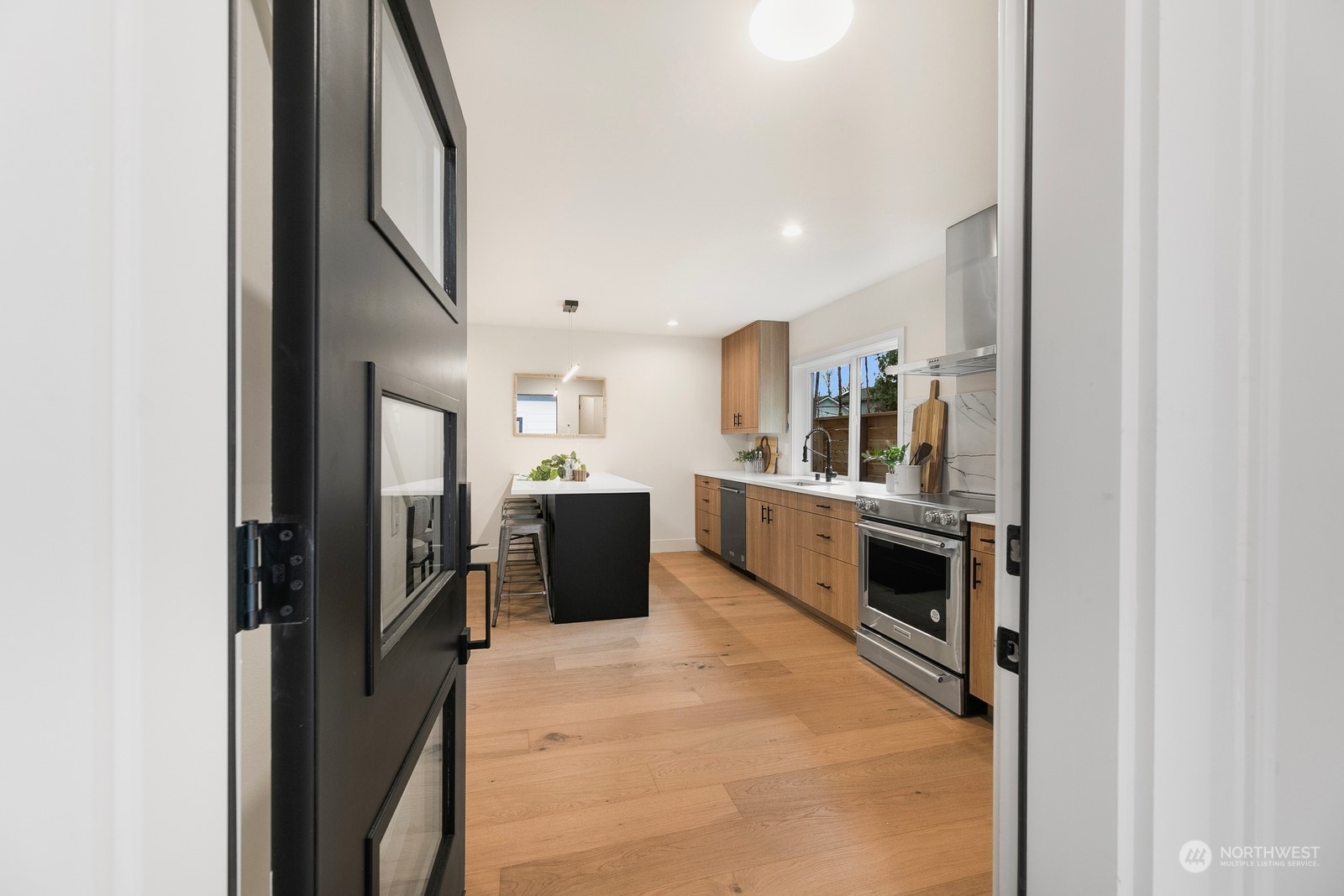 337 Northeast 90th Street, Unit 3 Seattle, WA 98115 - Photo 4 of 20 a view of a kitchen with appliances and cabinets