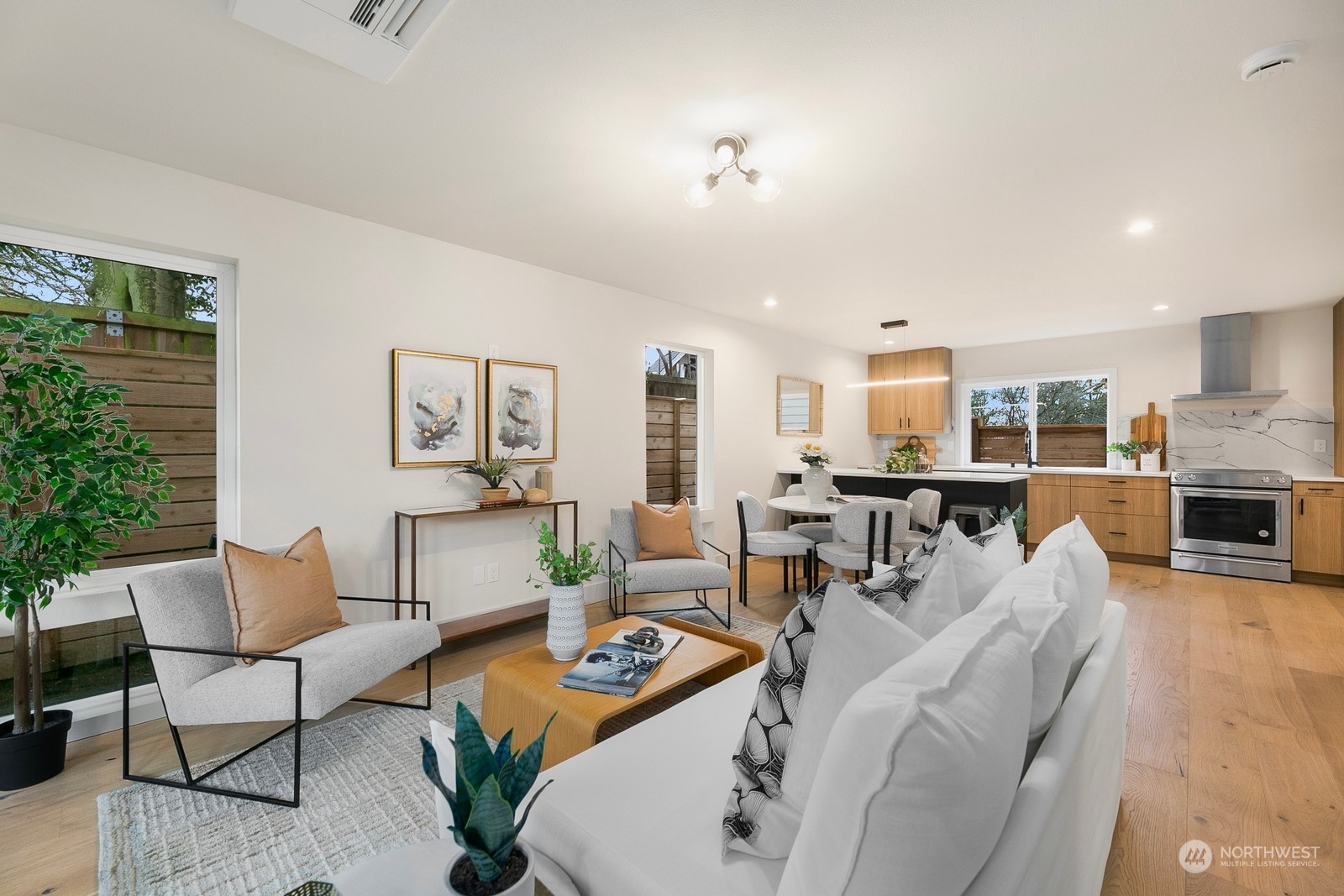 337 Northeast 90th Street, Unit 3 Seattle, WA 98115 - Photo 5 of 20 a living room with furniture and kitchen view