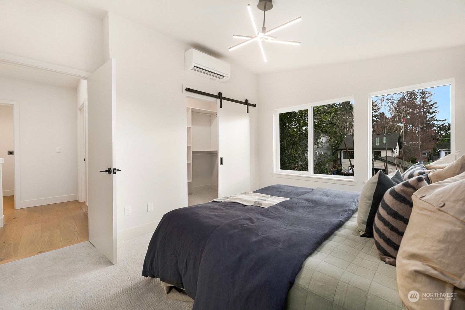 337 Northeast 90th Street, Unit 3 Seattle, WA 98115 - Photo 10 of 20 a bedroom with a bed and a large window