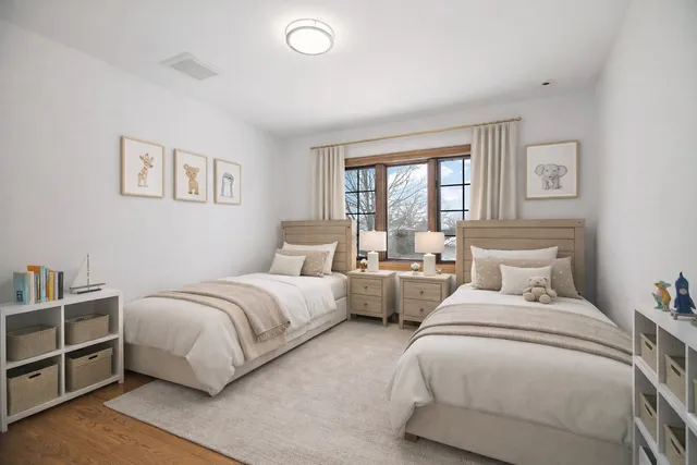 a bed room with two beds and a night stand