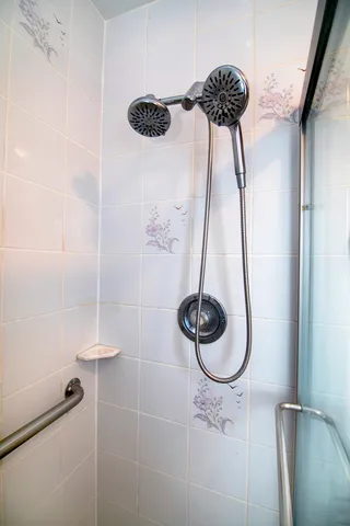 a bathroom with a sink a toilet and a shower