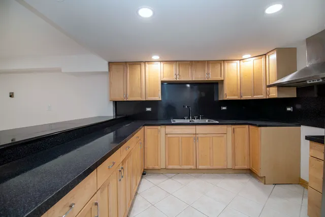 a large kitchen with cabinets