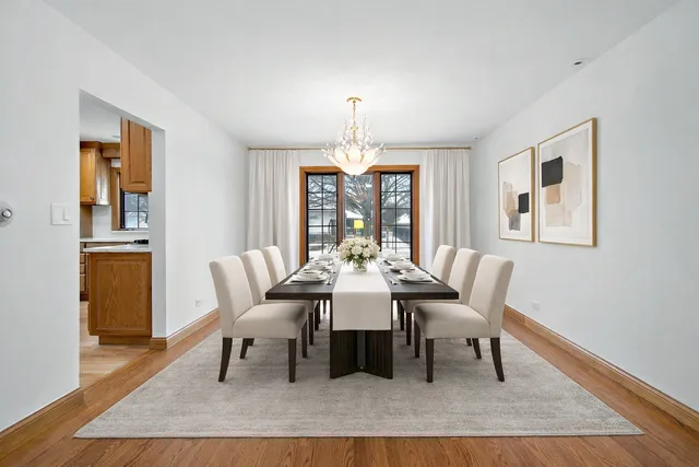 a dining room with furniture a rug and wooden floor