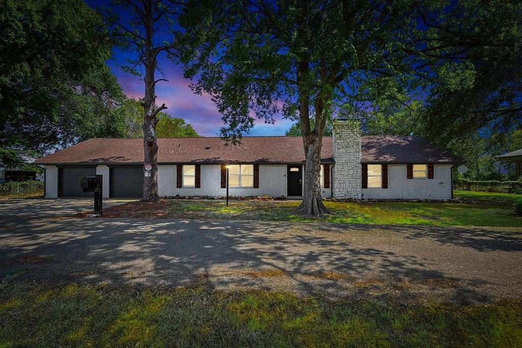 9884 Cherokee Trail Quinlan, TX 75474 - Photo 2 of 36 a view of a yard in front of a house