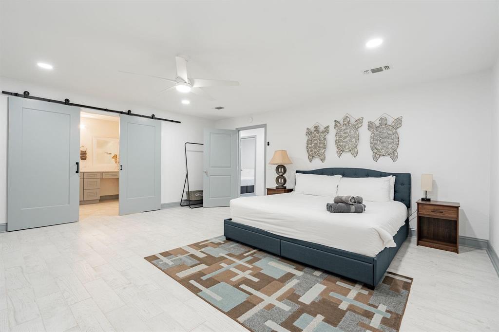 9884 Cherokee Trail Quinlan, TX 75474 - Photo 26 of 36 a spacious bedroom with a bed and a walk in closet