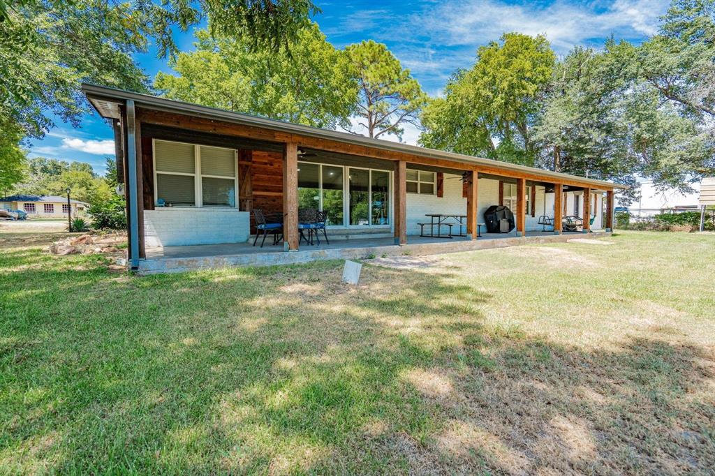 9884 Cherokee Trail Quinlan, TX 75474 - Photo 31 of 36 a house view with a garden space
