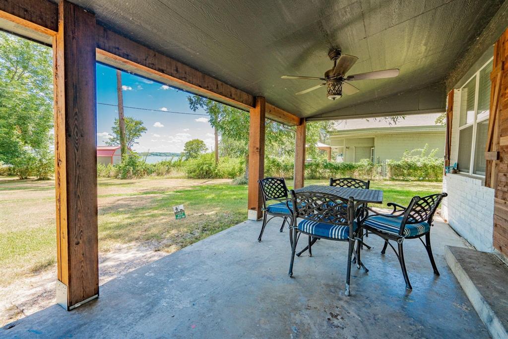 9884 Cherokee Trail Quinlan, TX 75474 - Photo 32 of 36 a dining room with furniture and garden view
