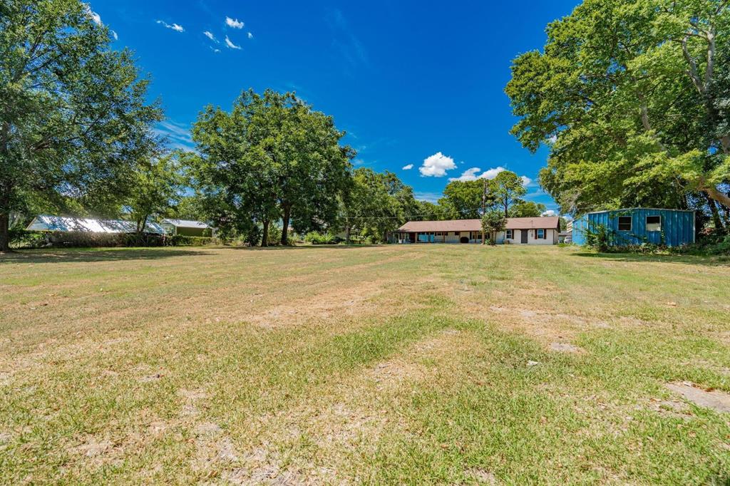 9884 Cherokee Trail Quinlan, TX 75474 - Photo 35 of 36 a view of a swimming pool and trees in the background