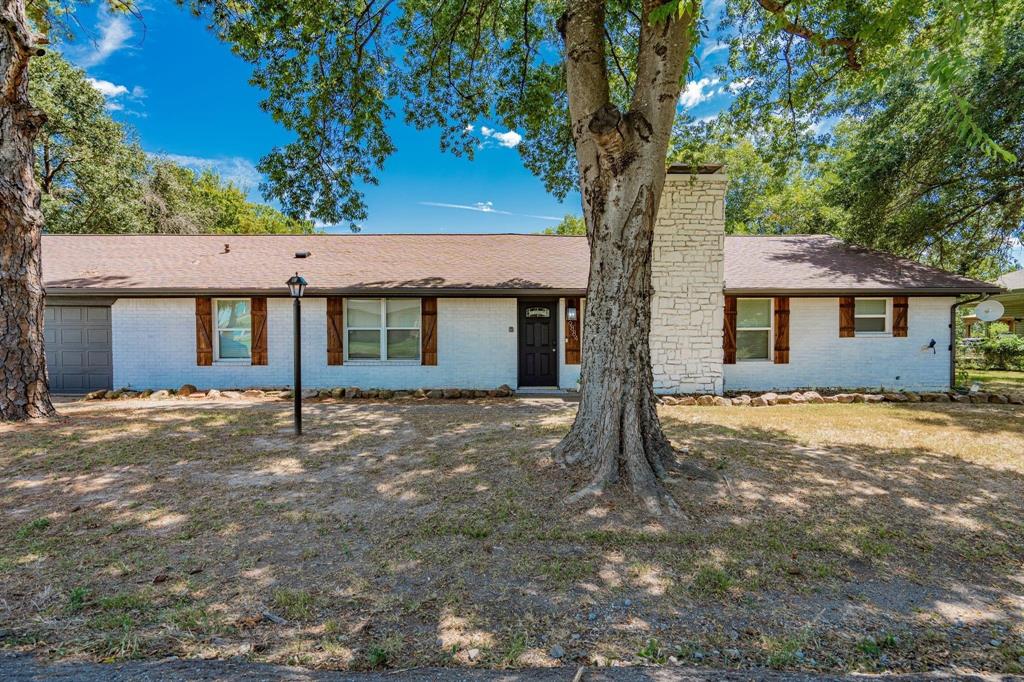 9884 Cherokee Trail Quinlan, TX 75474 - Photo 10 of 36 front view of a house with a yard