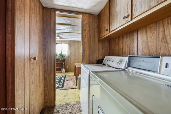 a view of a kitchen that has a sink and a stove in it