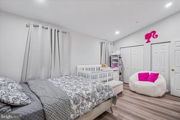 a bedroom with a bed and a couch