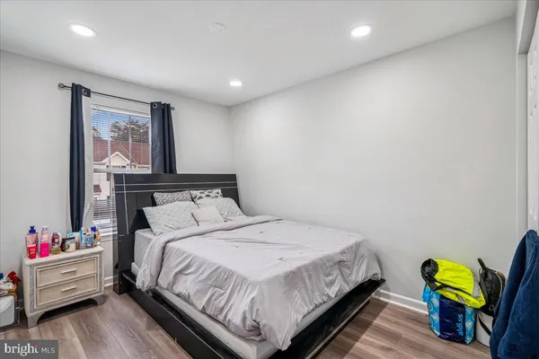 a bedroom with a bed and a couch
