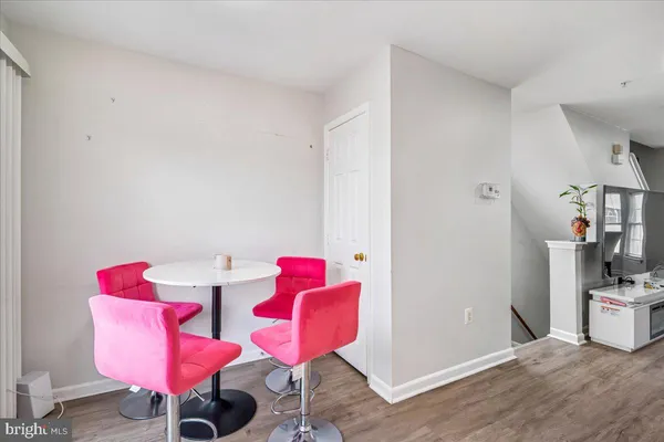 a bedroom with furniture and a chair