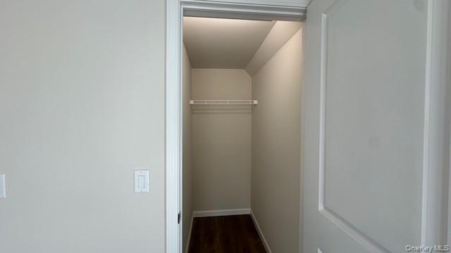 135 Cooper Road, Unit 3 Fishkill, NY 12524 - Photo 12 of 22 Bedroom 1 Walk in closet featuring dark hardwood / wood-style flooring