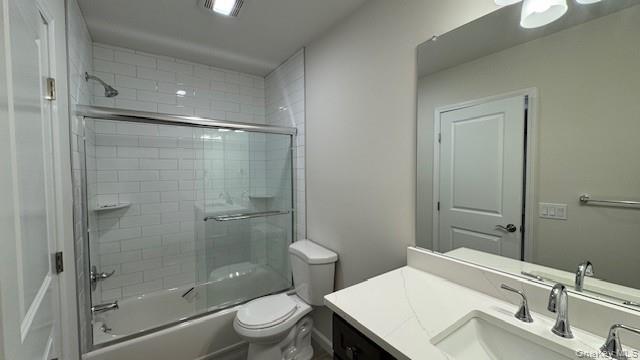 135 Cooper Road, Unit 3 Fishkill, NY 12524 - Photo 14 of 22 Main Full bathroom featuring vanity, bath / shower combo with glass door, and toilet