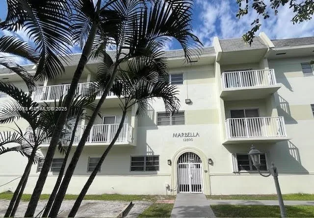 a view of white house with a street