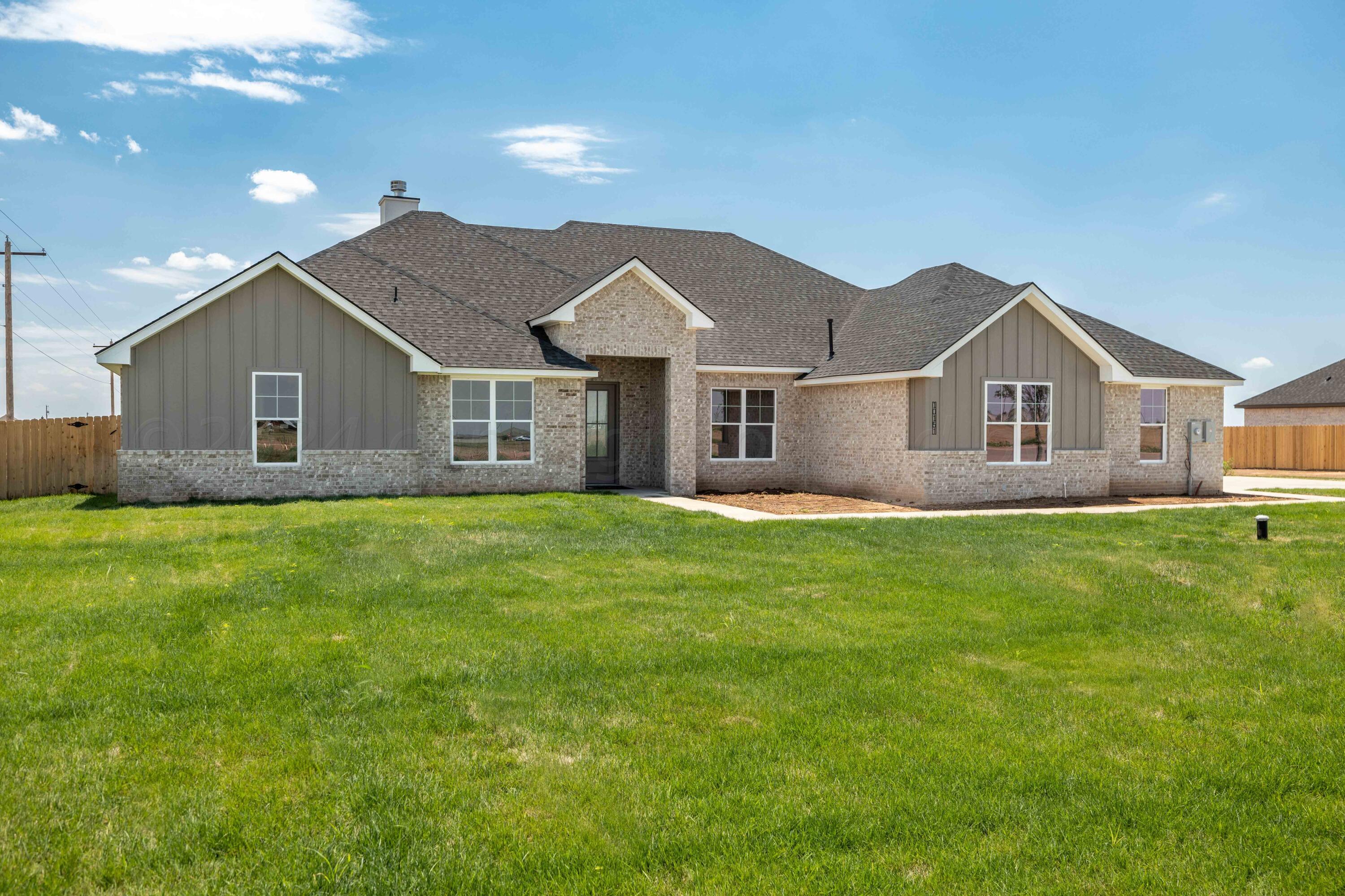 10151 Cactus Flower Road Amarillo, TX 79119 - Photo 1 of 29 a front view of a house with a garden