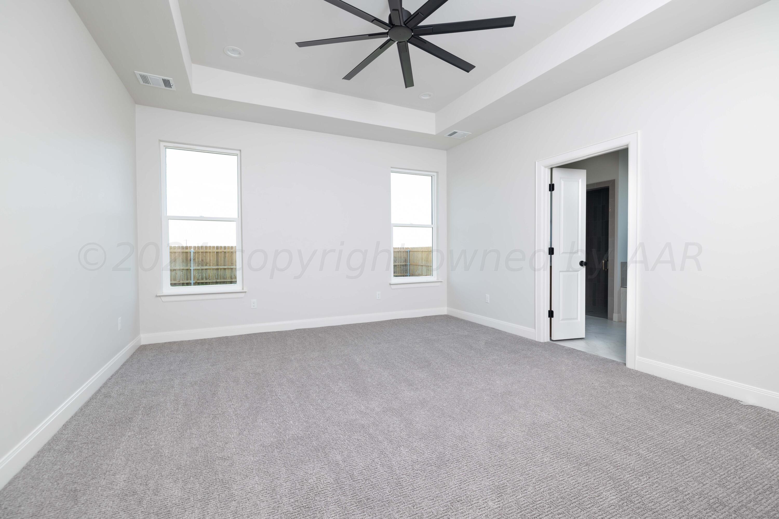10151 Cactus Flower Road Amarillo, TX 79119 - Photo 14 of 29 a view of an empty room with a window