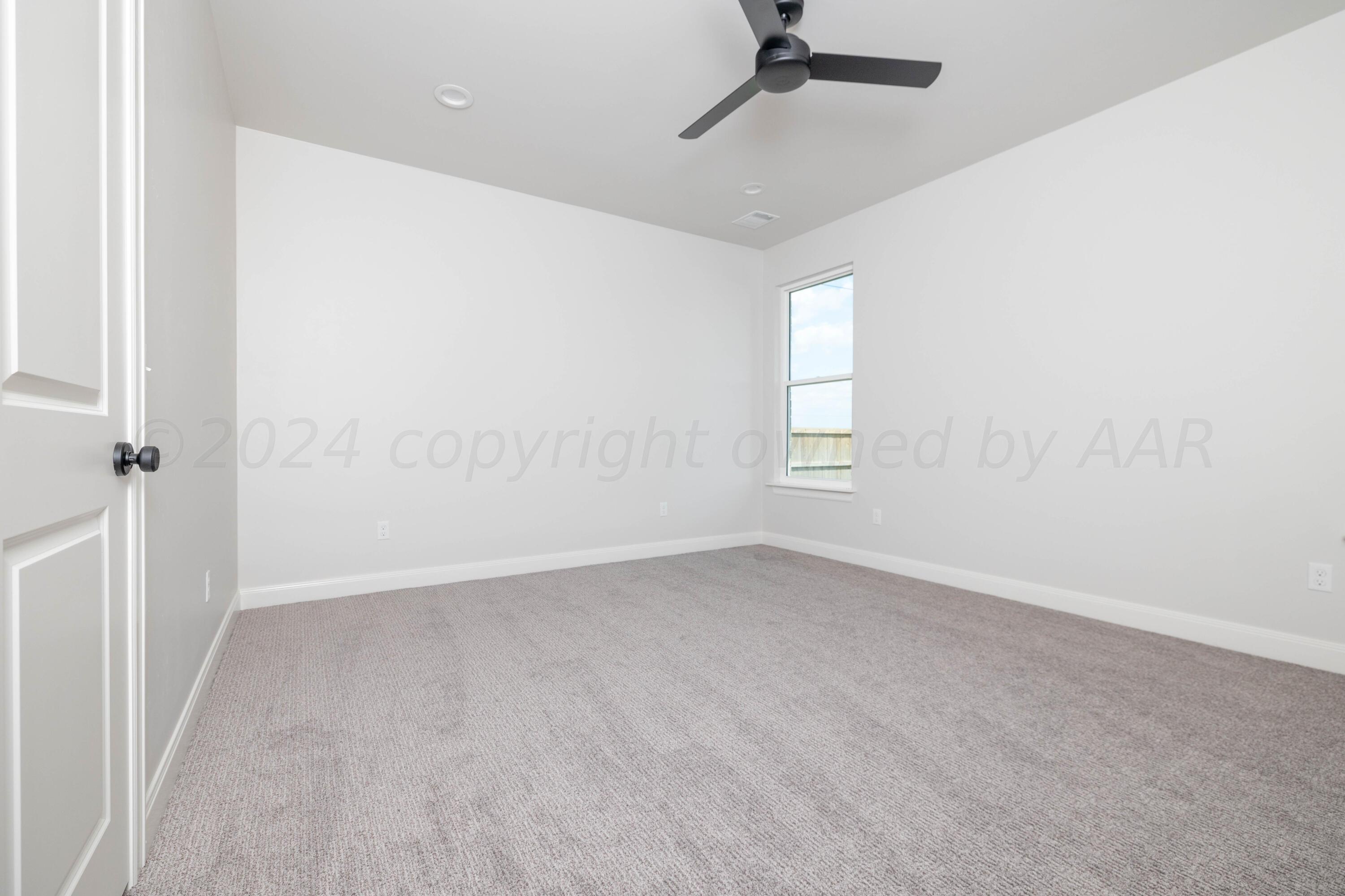 10151 Cactus Flower Road Amarillo, TX 79119 - Photo 21 of 29 an empty room with a window