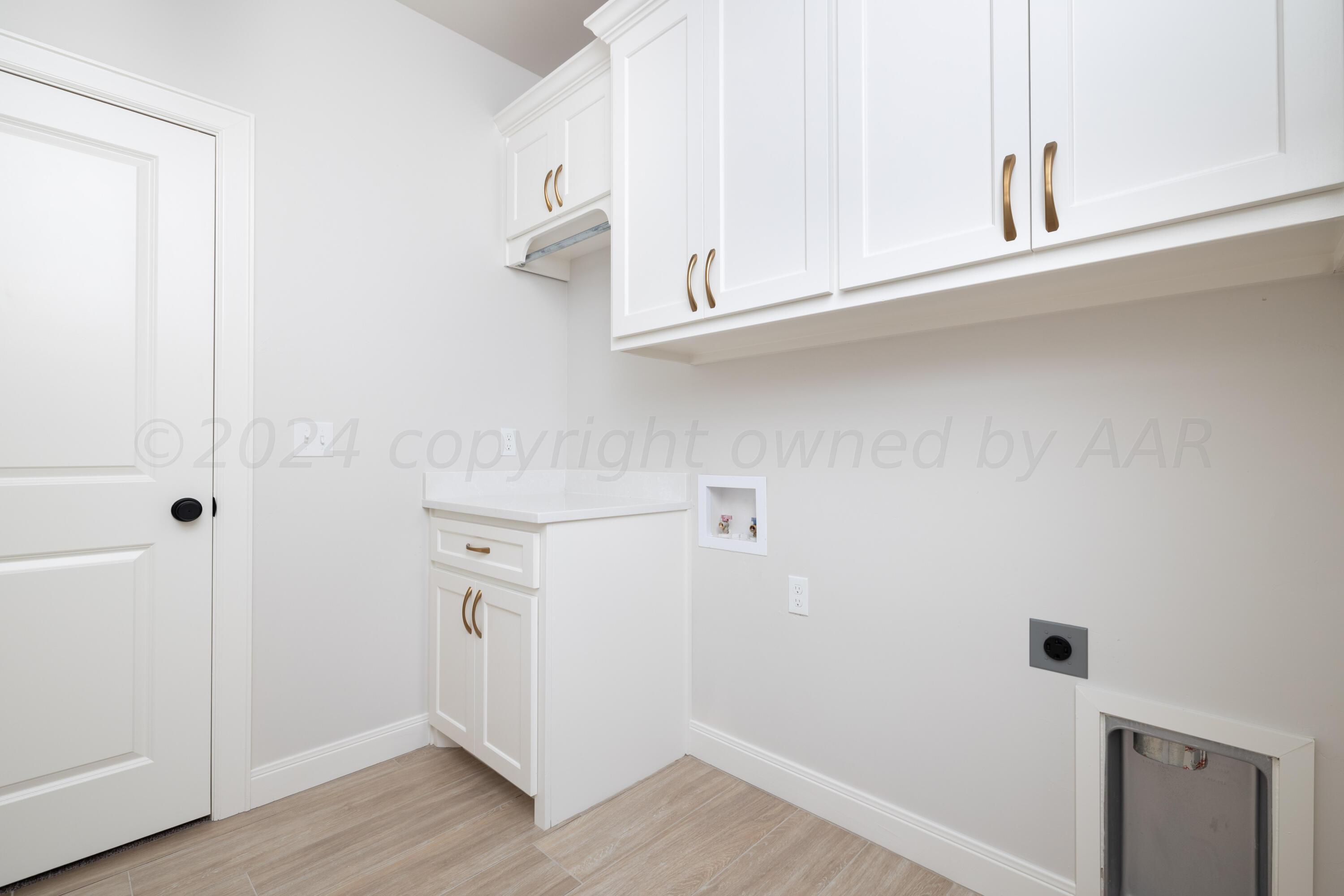 10151 Cactus Flower Road Amarillo, TX 79119 - Photo 25 of 29 a view of cabinets and wooden floor