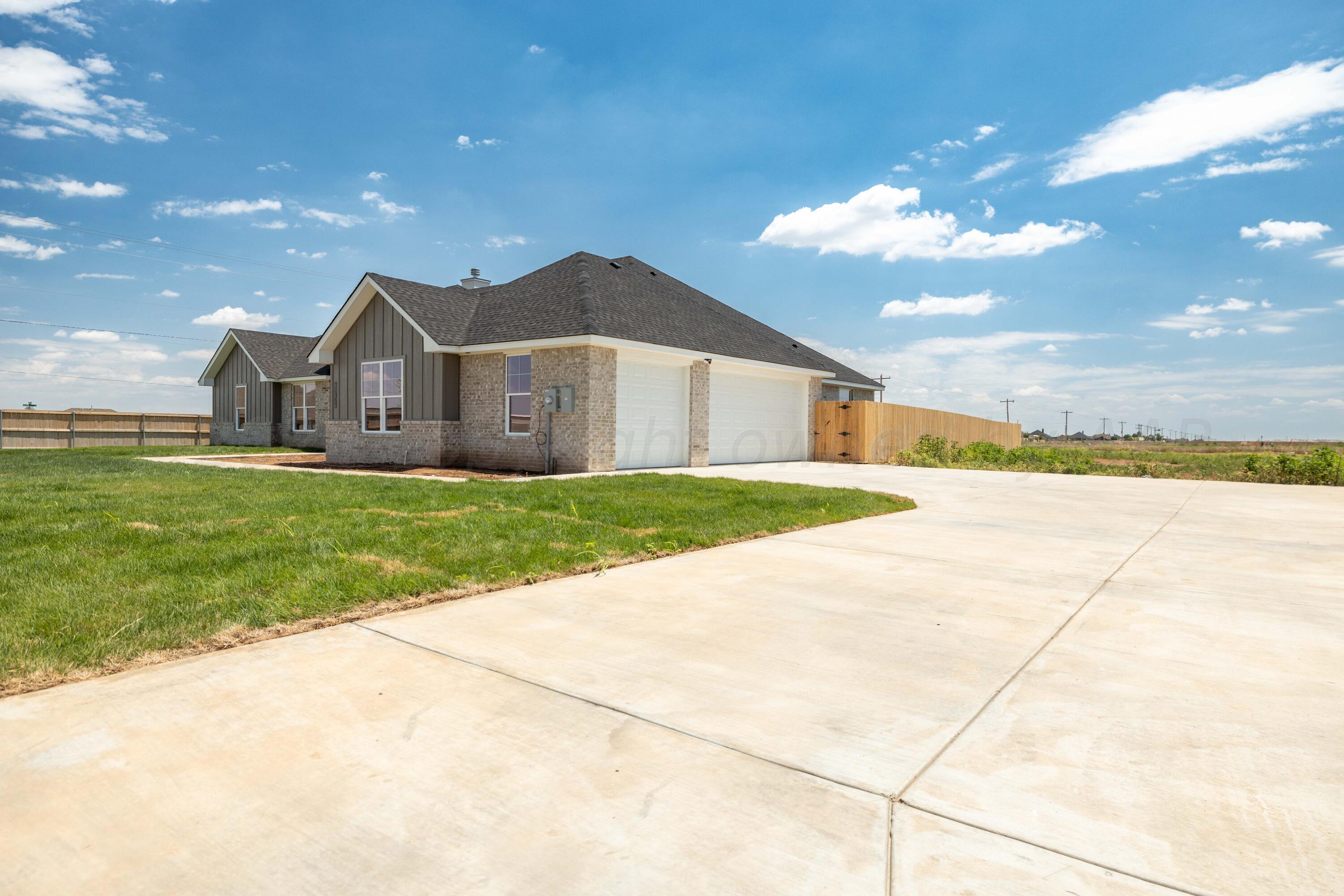 10151 Cactus Flower Road Amarillo, TX 79119 - Photo 4 of 29 a view of a house with a yard