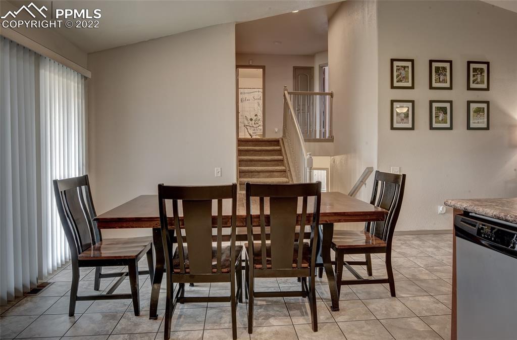 5912 Polly Court Pueblo, CO 81008 - Photo 14 of 40 a view of a dining room with furniture and wooden floor
