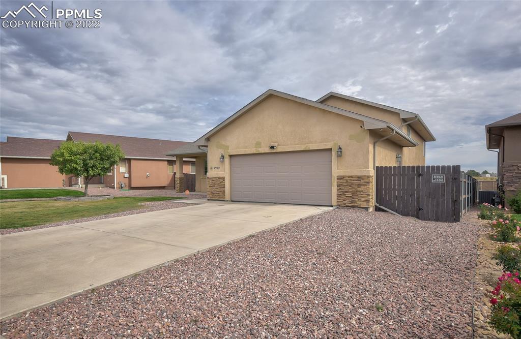 5912 Polly Court Pueblo, CO 81008 - Photo 3 of 40 a house view with a outdoor space