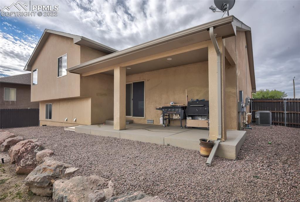 5912 Polly Court Pueblo, CO 81008 - Photo 39 of 40 a view of a house with backyard and sitting area