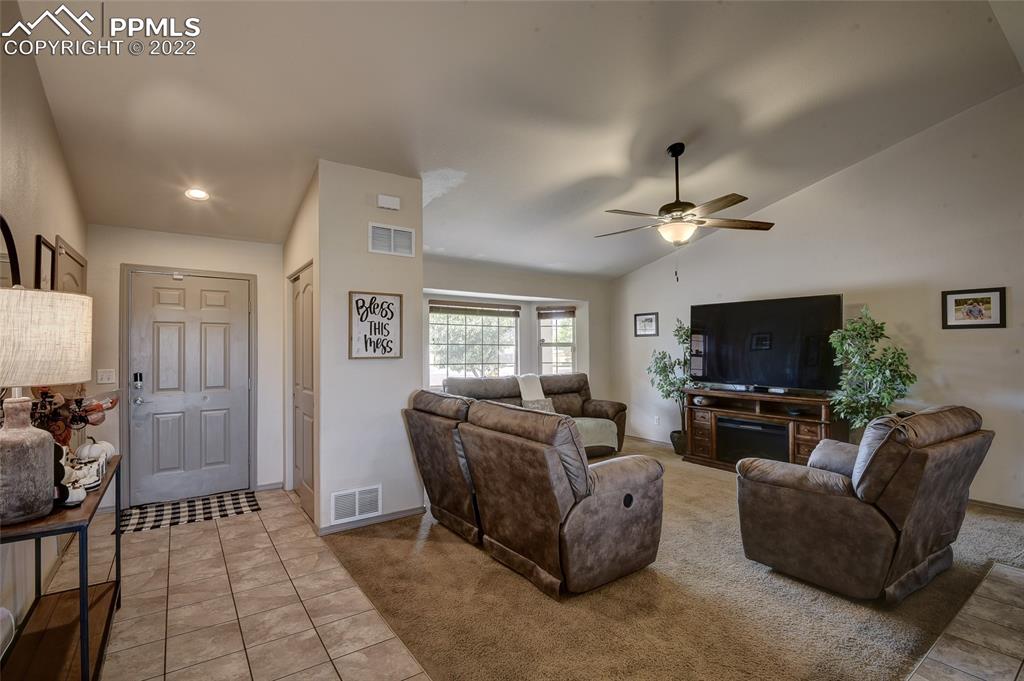 5912 Polly Court Pueblo, CO 81008 - Photo 7 of 40 a living room with furniture and a flat screen tv