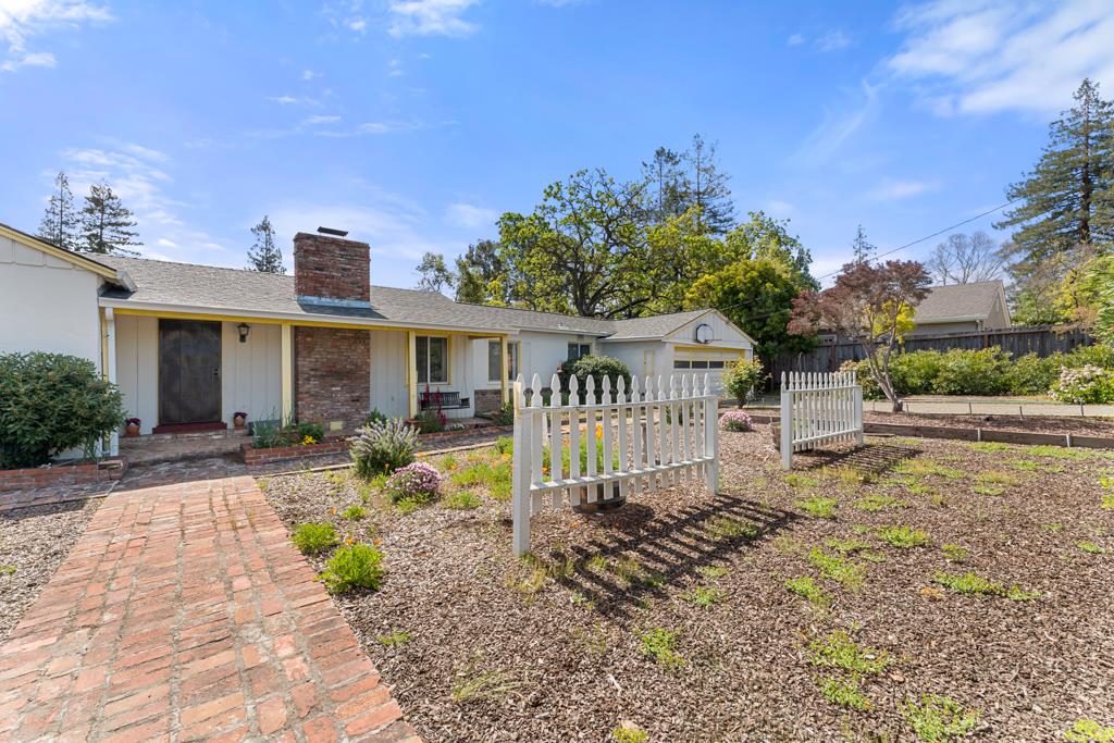 2101 Sharon Road Menlo Park, CA 94025 - Photo 26 of 31 a front view of a house with garden