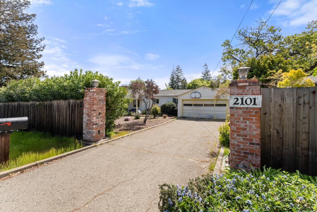 2101 Sharon Road Menlo Park, CA 94025 - Photo 28 of 31 a view of a street with potted plants and wooden fence