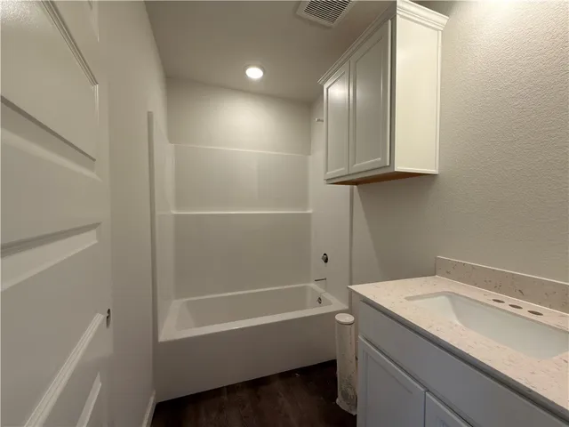 a view of a livingroom from a hallway