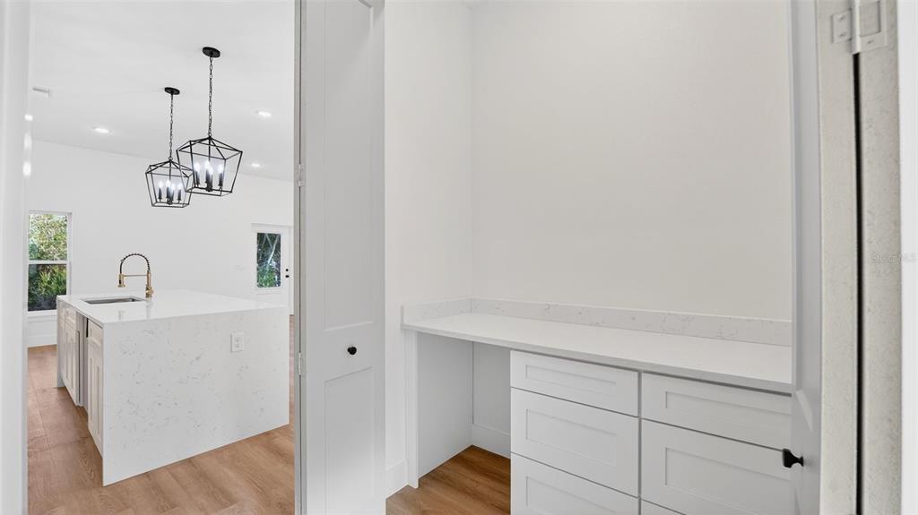 257 Lago Vista Street DeBary, FL 32713 - Photo 20 of 35 a very nice looking hallway with white cabinets