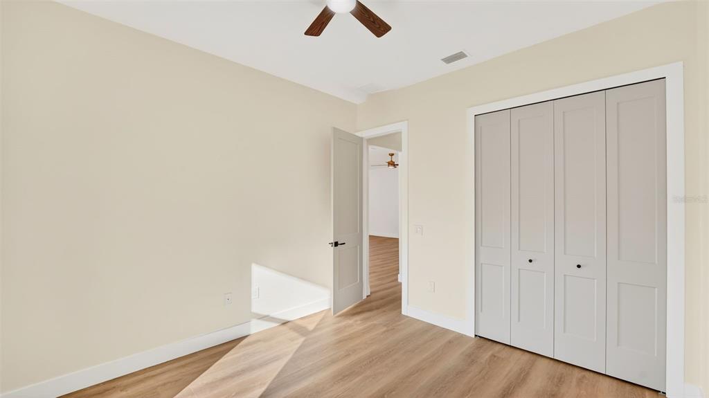 257 Lago Vista Street DeBary, FL 32713 - Photo 28 of 35 an empty room with closet and windows