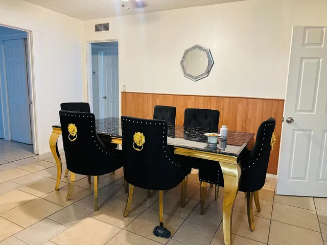 a view of a workspace with furniture