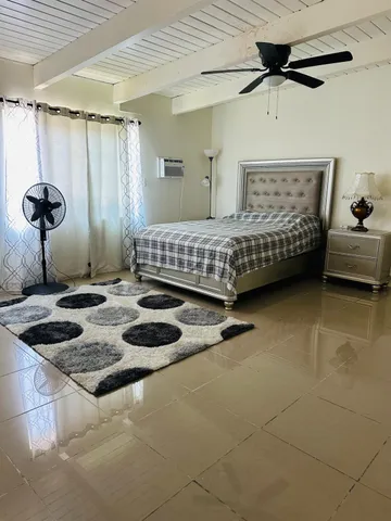 a bedroom with a bed and a sink