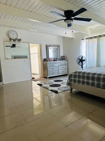 a room with a bed and a window