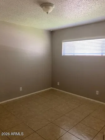 an empty room and window