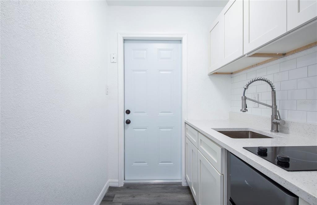 717 East Gulf Boulevard Indian Rocks Beach, FL 33785 - Photo 33 of 65 a close view of a sink and dishwasher in a kitchen