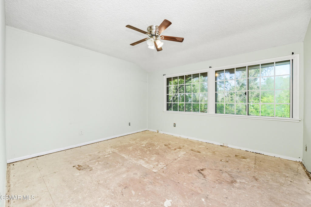 24910 John Fremont Road Hidden Hills, CA 91302 - Photo 29 of 67 an empty room with wooden floor and windows