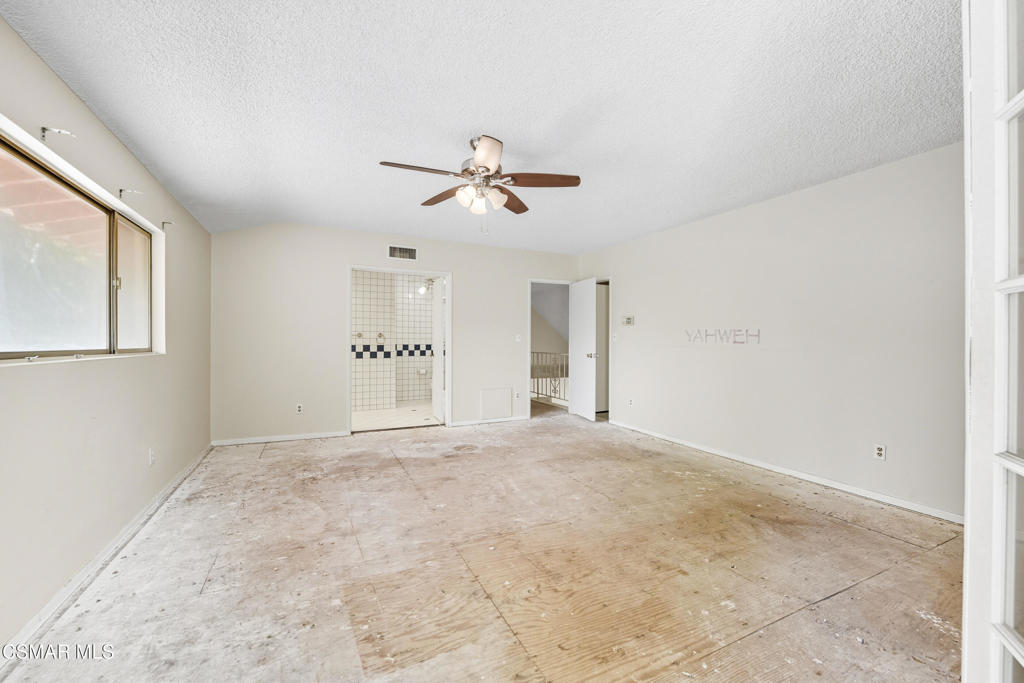 24910 John Fremont Road Hidden Hills, CA 91302 - Photo 32 of 67 a view of an empty room with a ceiling fan