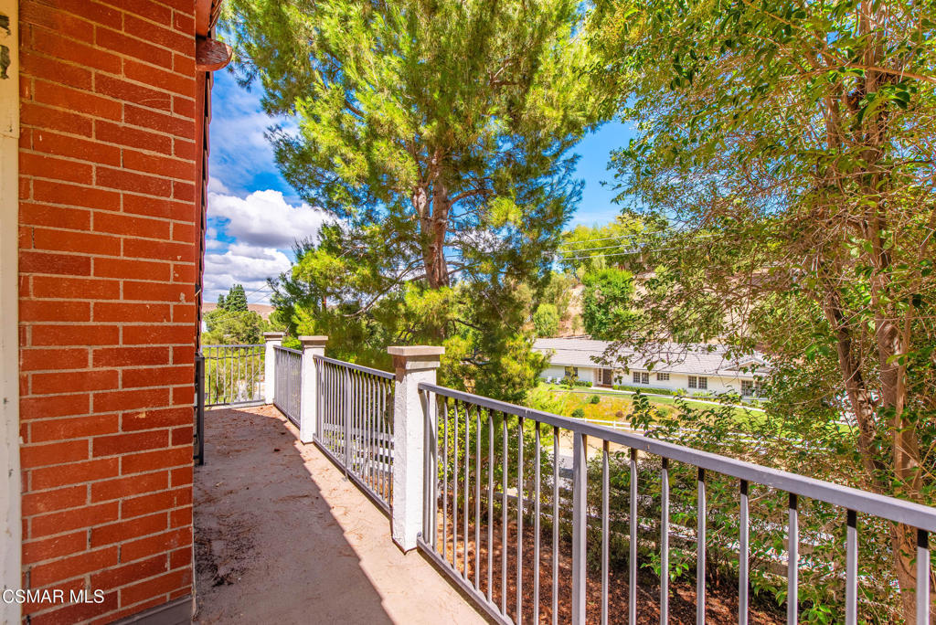 24910 John Fremont Road Hidden Hills, CA 91302 - Photo 36 of 67 a view of a balcony with a tree