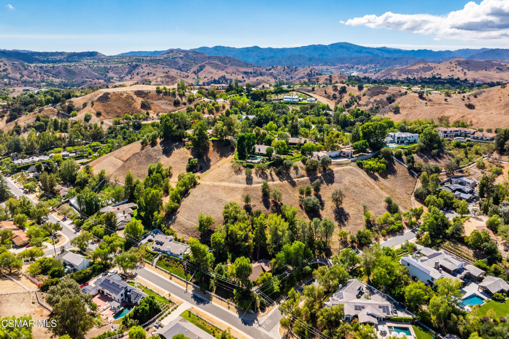 24910 John Fremont Road Hidden Hills, CA 91302 - Photo 47 of 67 an aerial view of residential house with yard and mountain view in back