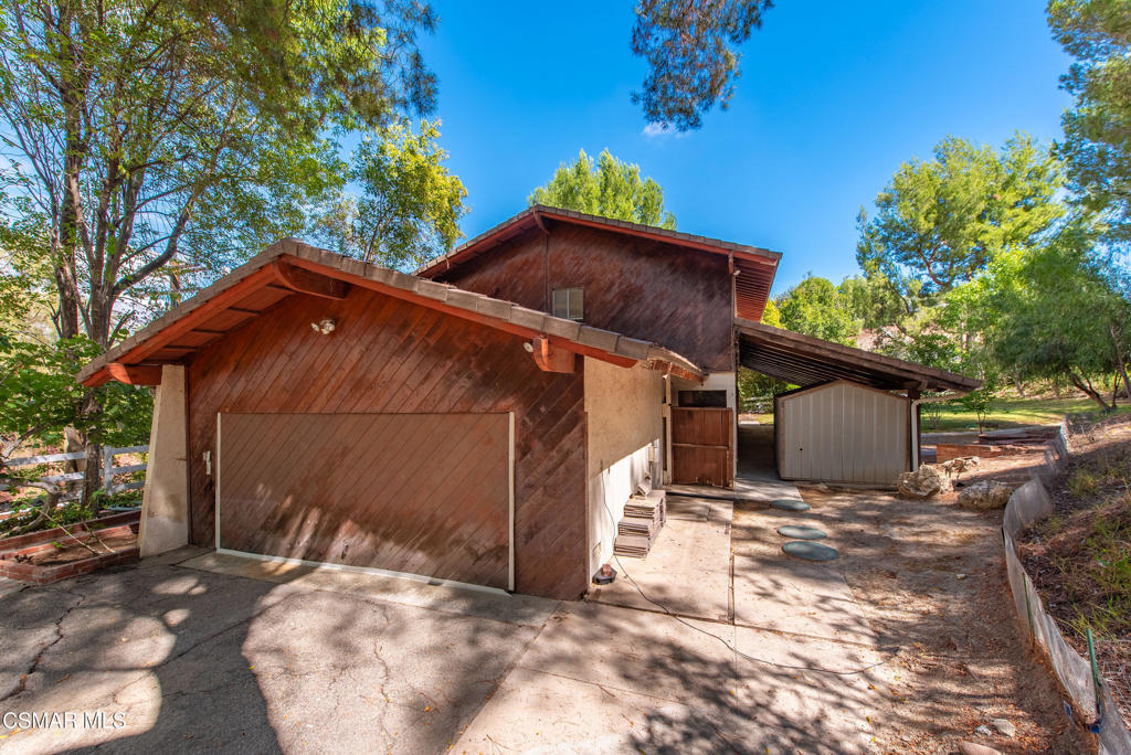 24910 John Fremont Road Hidden Hills, CA 91302 - Photo 6 of 67 a view of a house with a yard